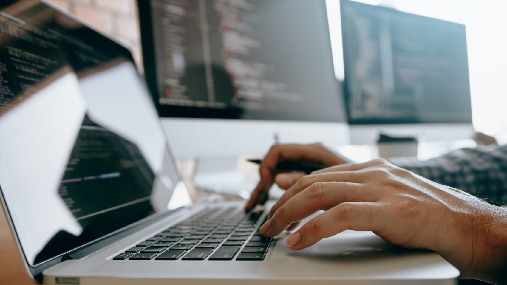 guy in web agency writing codes